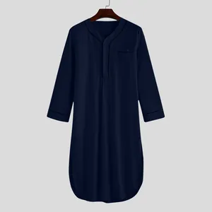 Close-up of a navy blue men's nightgown with contrast piping on the collar and pocket.