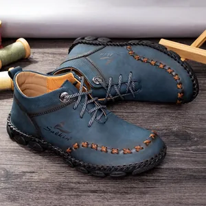 Close-up detail of hand-stitched blue leather mid-top Martin boots for men outdoor wear
