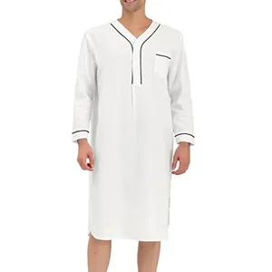 Detailed view of white men's long sleeve nightgown featuring black contrast piping and chest pocket