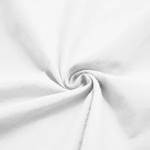 Close-up macro view showing the soft white fabric texture of a premium men's nightgown.