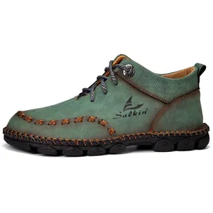 Detail of handmade green Martin boot with intricate stitching and perforated texture