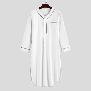 Front view of a white men's long-sleeved sleep robe with black piping on a hanger