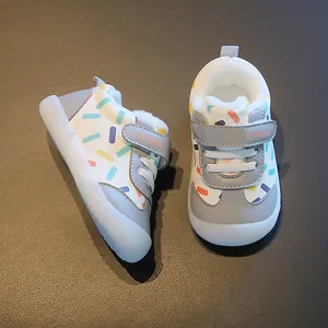 Warm winter baby walking shoes with fleece lining and colorful pattern decor.