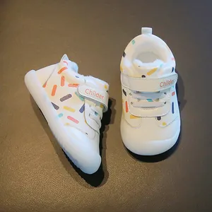 White toddler winter shoes with colorful sprinkles pattern, fleece lining and velcro strap