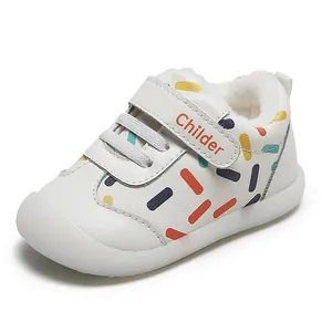 Cozy winter baby walking shoes with warm white fleece lining and colorful sprinkle pattern