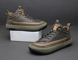 Detail shot of men's olive green high-top leather casual shoes with suede accents
