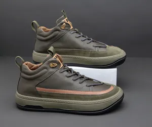 Detail of olive green leather high-top men's sneakers with premium suede accents