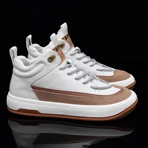 Detailed side view of premium white high-top leather sneakers with brown suede accents
