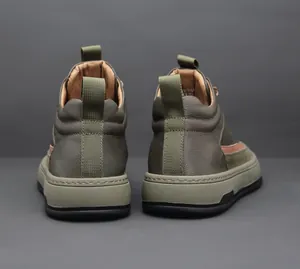 Detailed rear view of olive green cowhide high-top casual boots featuring heel pull tabs