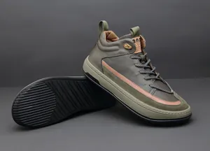 Detailed view of olive green leather high-top men's sneakers showing sole and profile