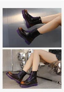 Detailed view of women's black Martin boots with purple lug soles worn by a model