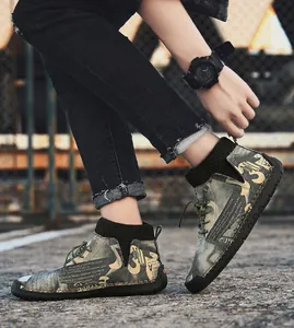 Close-up of men's urban high-top casual shoes with camouflage text print pattern