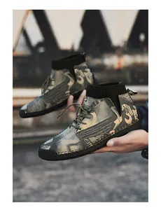 Detailed view of men's high-top fashion casual shoes featuring graffiti print and a sock collar