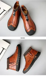 Detail view of brown leather mid-top boots with sock collar and rubber toe cap