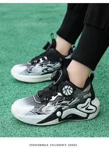 Detailed side view of boys basketball shoes featuring rotary laces and flame patterns