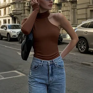Detail view of brown one-shoulder long sleeve ribbed bodysuit top