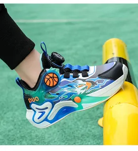 Detail view of boys' leather basketball shoes with dial lacing system on green turf.