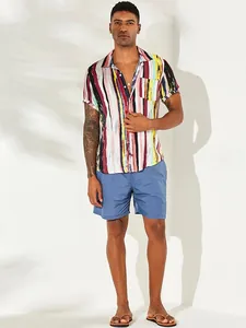 Full view of loose casual striped short-sleeved men's beach print shirt on model