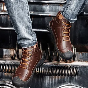 Vintage men's brown leather high-top Martin boots with rugged industrial background