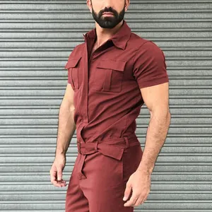Close-up of men's burgundy short-sleeve utility jumpsuit featuring a matching waist belt