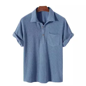 Relaxed fit men's short sleeve polo shirt in blue waffle knit fabric with chest pocket