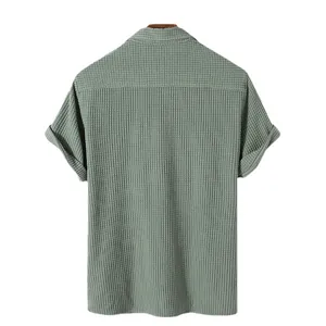 Back view of men's casual sage green waffle textured short sleeve shirt with collar