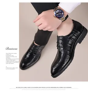 Detailed side view of classic black leather pointed-toe business dress shoes for men.