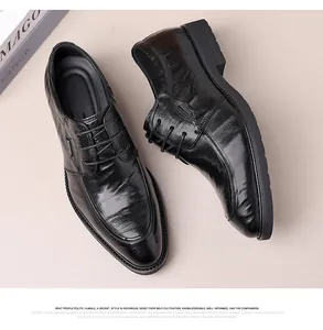 Detail view of black genuine sheepskin men's business dress shoes with lace-up design