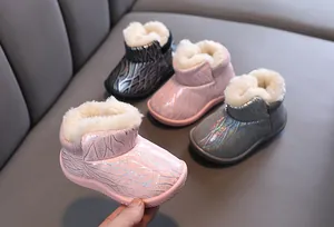 Detailed view of children's winter snow boots with warm plush lining in multiple colors