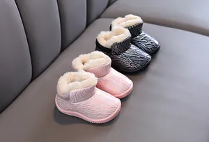 Warm children's snow boots in pink and black featuring soft plush lining and sparkly uppers.
