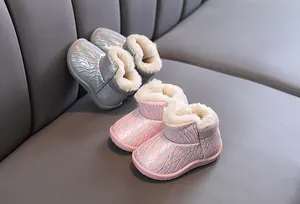 Warm children's snow boots with iridescent finish and cozy faux fur lining