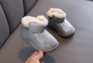 Detailed close-up view of children's warm silver snow boots featuring soft faux fur lining