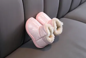Cozy pink children's winter snow boots with thick plush lining and shimmering patterns