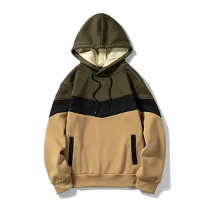 Detailed view of a tri-color block hoodie with drawstring hood and side pockets