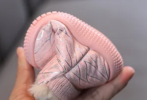 Detail view of pink flexible sole kids winter snow boots with warm faux fur lining