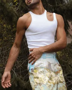 Close-up view of men's white ribbed tank top featuring a unique shoulder cutout