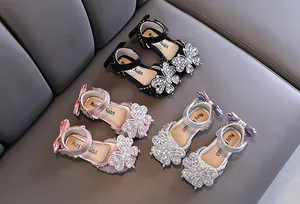 Detailed view of rhinestone butterfly girls princess sandals in black, pink, and silver