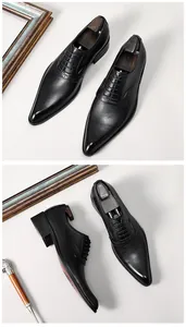 Detailed view of elegant men's black pointed-toe high-heel leather dress shoes for weddings