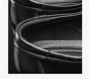 Close-up macro view of the premium leather texture and stitching on business dress shoes.