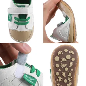 Soft sole baby pre-walker shoes in white and green with non-slip bottom for infants