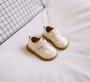 Elegant cream-colored baby soft-sole leather shoes with Velcro straps for toddler girls