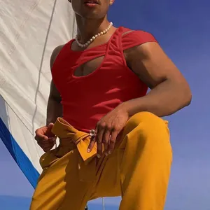 Close-up of red cutout sleeveless tank top showing unique shoulder design for men.