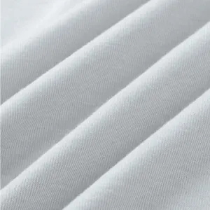 Detailed macro view showing the soft texture of white breathable knitted cotton fabric.