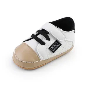 Stylish infant prewalker shoes in white and tan faux leather with adjustable velcro strap