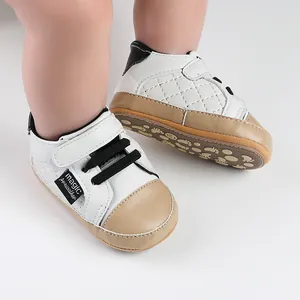 White and tan soft sole baby prewalker shoes with quilted side detail and velcro closure