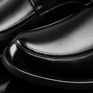 Macro shot of premium genuine leather men's business dress shoes with fine stitching detail