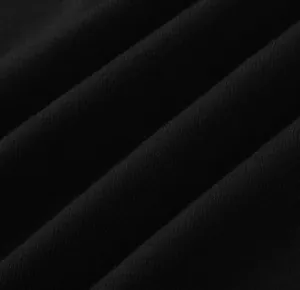 Macro shot showing the soft texture and weave of black cotton fabric for men's vest.