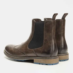 Men's retro brown Chelsea boots featuring classic brogue wingtip detailing and elastic side.