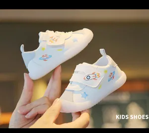 Soft-soled white toddler shoes featuring cute space rocket and planet prints for little kids