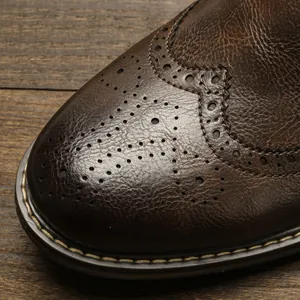 Detailed macro shot of vintage brown leather Brogue boot with classic wingtip perforation
